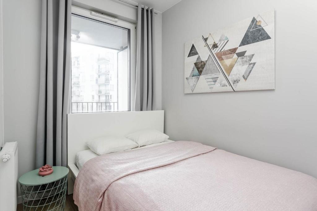Posteľ alebo postele v izbe v ubytovaní Chill Apartments Mokotow Business Park