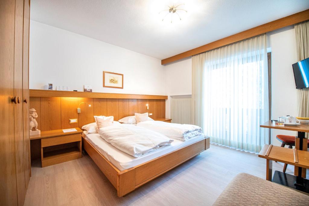 Postel nebo postele na pokoji v ubytování Garni Bondi