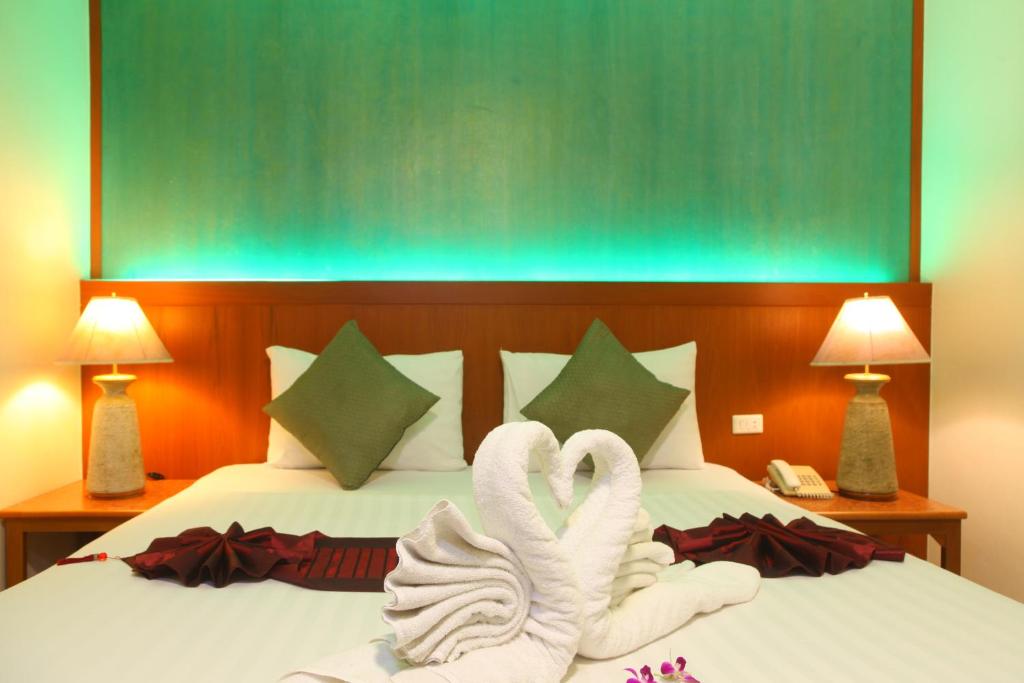 Postel nebo postele na pokoji v ubytování Orchid Resortel