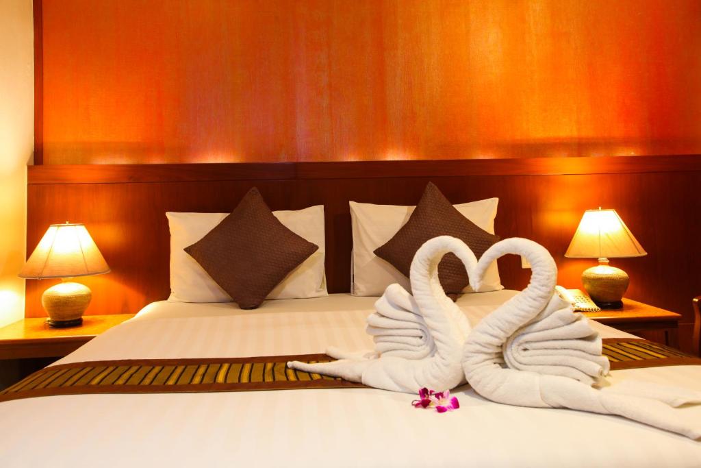 Postel nebo postele na pokoji v ubytování Orchid Resortel