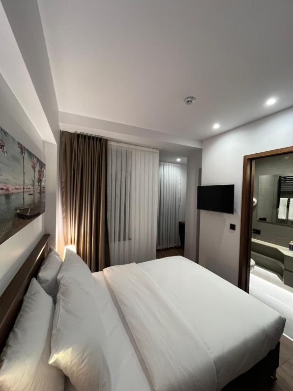 Postel nebo postele na pokoji v ubytování PALMERA HAGIA SOPHIA hotel