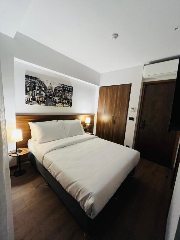 Postel nebo postele na pokoji v ubytování PALMERA HAGIA SOPHIA hotel
