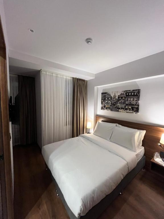 Postel nebo postele na pokoji v ubytování PALMERA HAGIA SOPHIA hotel