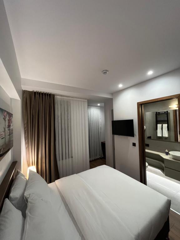 Postel nebo postele na pokoji v ubytování PALMERA HAGIA SOPHIA hotel