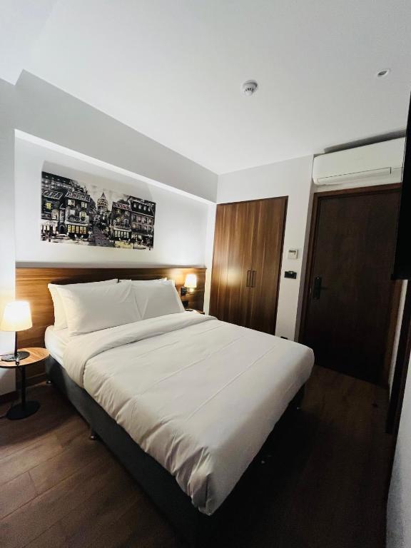 Postel nebo postele na pokoji v ubytování PALMERA HAGIA SOPHIA hotel