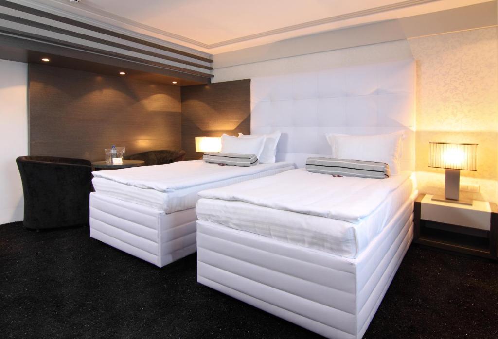 Postel nebo postele na pokoji v ubytování Grand Hotel Riga