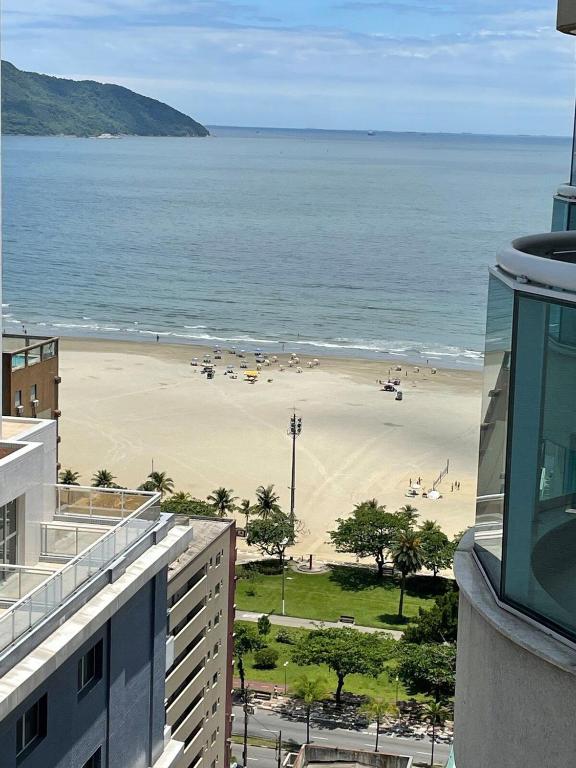 a view of a beach from a building at Unique (Ex-Estanconfor) veja o mar do apto 2302 in Santos