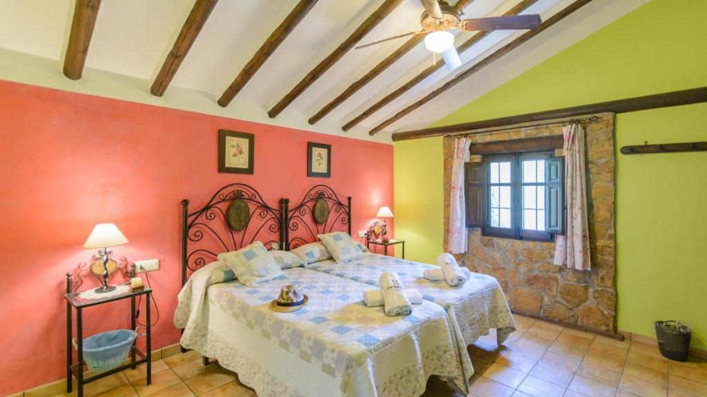 Posteľ alebo postele v izbe v ubytovaní Combinación Cortijo y Mirador Casablanca Priego de Córdoba by Ruralidays