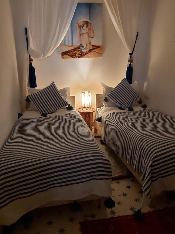 Postel nebo postele na pokoji v ubytování Riad Azul