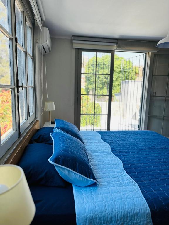 Postel nebo postele na pokoji v ubytování MAKTVB Brasil - Hostal Boutique