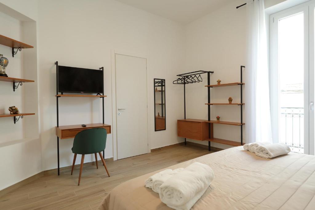 Postel nebo postele na pokoji v ubytování Il Canto di Ligea