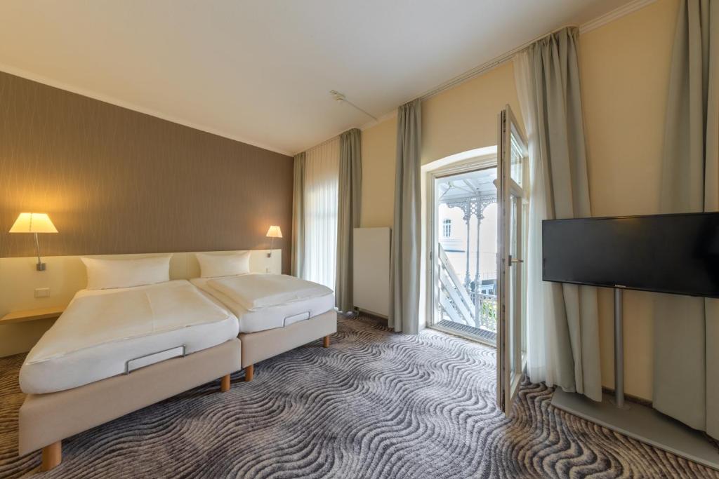 Postel nebo postele na pokoji v ubytování Michels Thalasso Hotel Nordseehaus