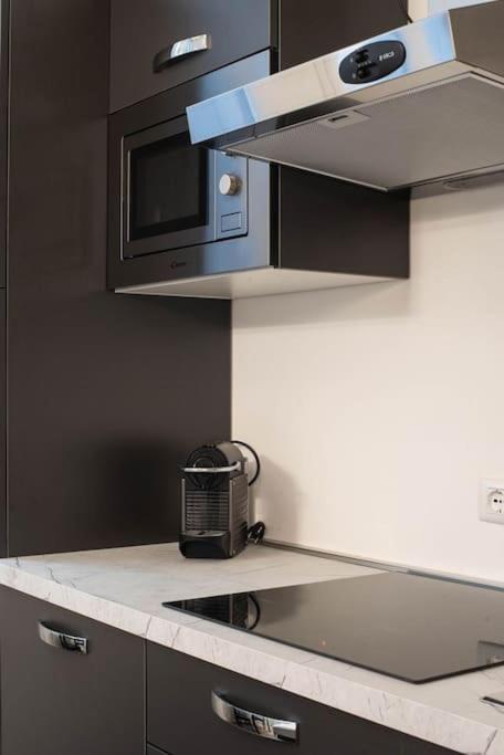 A kitchen or kitchenette at IM Apartments - Appartamento in zona Piazza Repubblica - Centrale