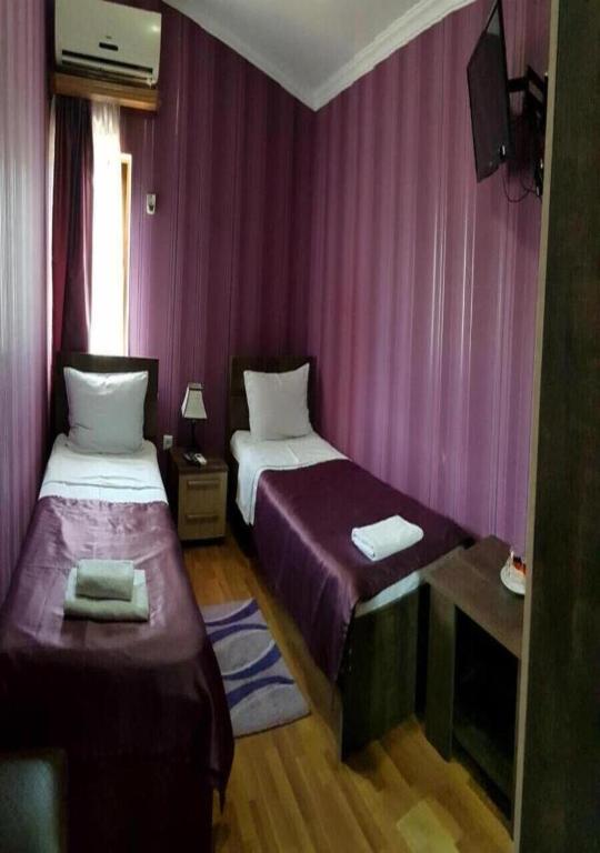 Postel nebo postele na pokoji v ubytování Bonus Inn