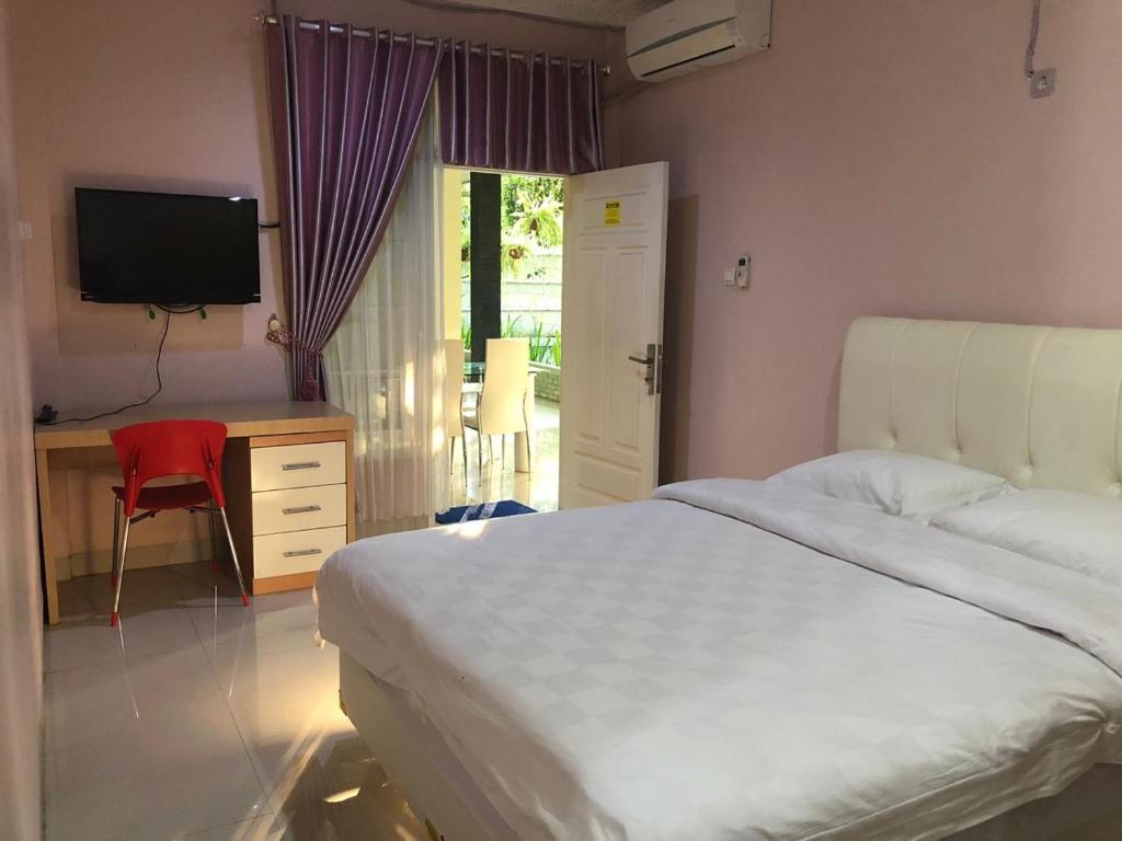 Łóżko lub łóżka w pokoju w obiekcie Cemara Residence