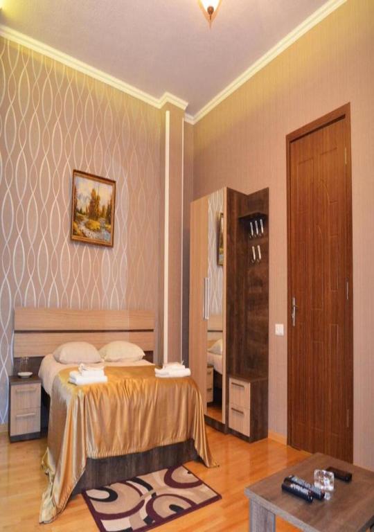 Postel nebo postele na pokoji v ubytování Bonus Inn