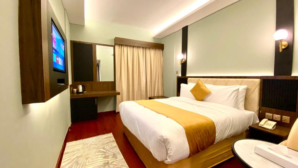 Letto o letti in una camera di Concorde Inn Hotel