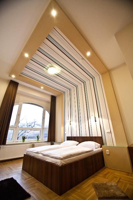 Postel nebo postele na pokoji v ubytování SasOne Rooms