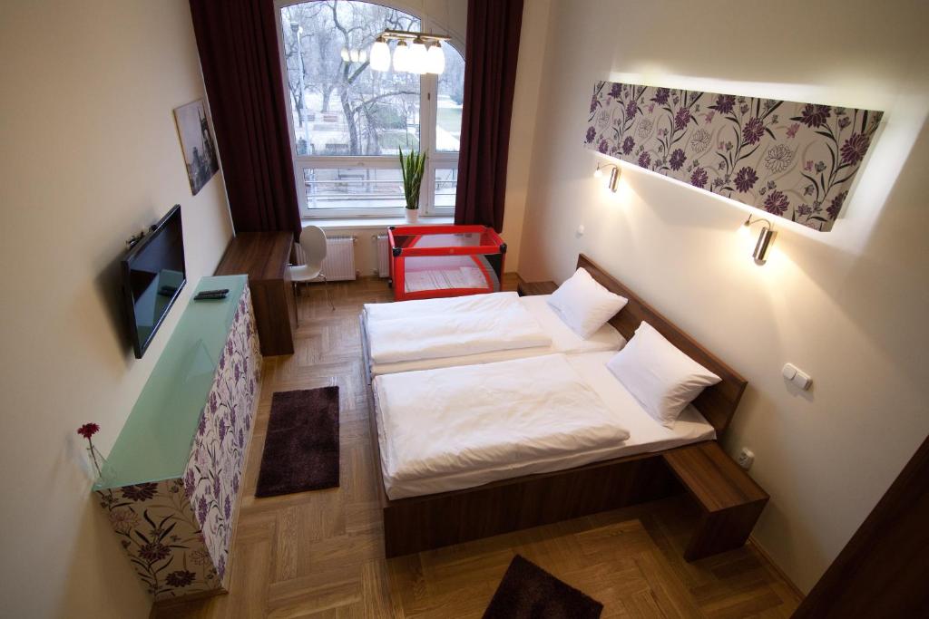 Postel nebo postele na pokoji v ubytování SasOne Rooms
