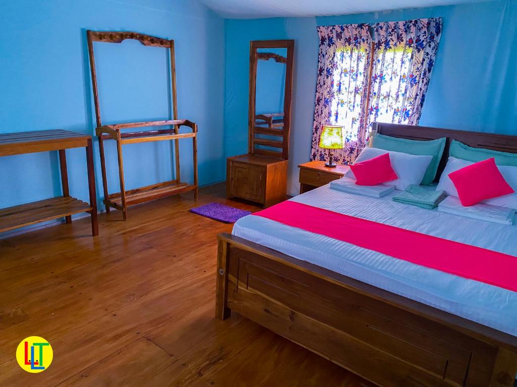 Postel nebo postele na pokoji v ubytování mango villa wilpattu
