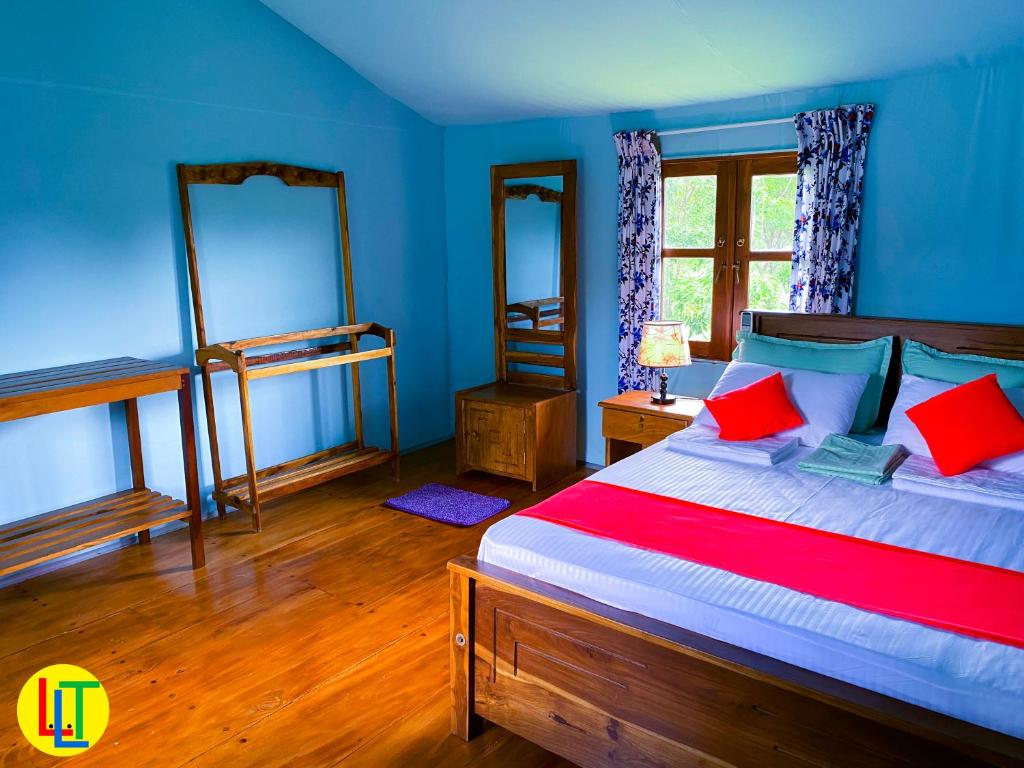 Postel nebo postele na pokoji v ubytování mango villa wilpattu