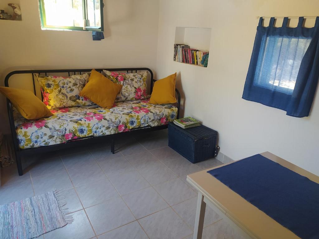 a living room with a couch and a table at Robinson house Kata in Milna