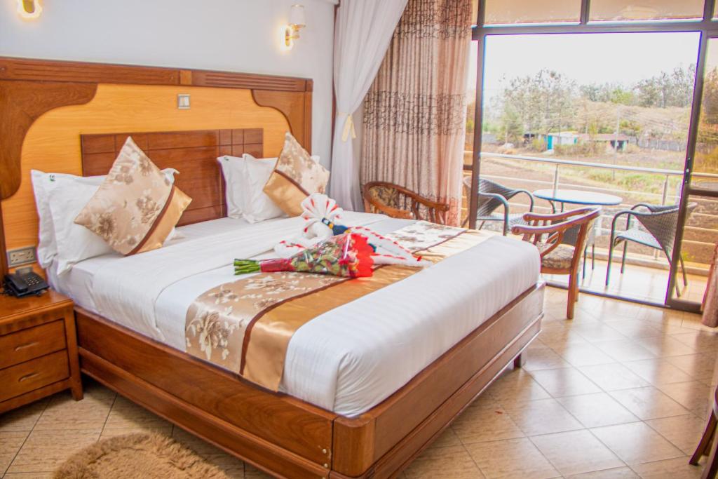 Postel nebo postele na pokoji v ubytování Grand Winston Hotel