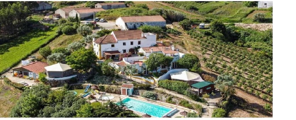 an aerial view of a house with a swimming pool at Quinta Laranja - Turismo Rural - in Alvorninha