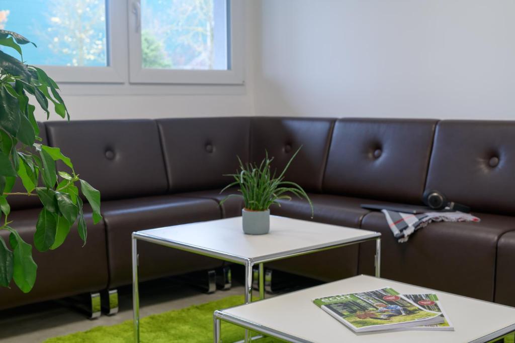Posezení v ubytování CiTTy Hotel Schweinfurt
