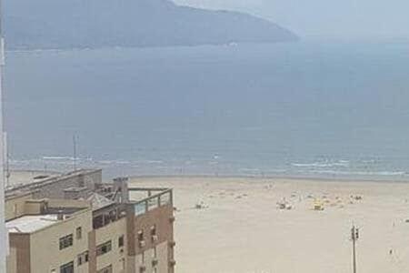 a view of a beach with buildings and the ocean at 2 quartos- Estanconfor Vista Mar AC garagem sacada in Santos
