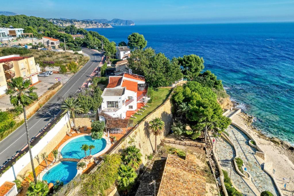 an aerial view of a villa and the ocean at Perla del Mar Calpe in Benissa
