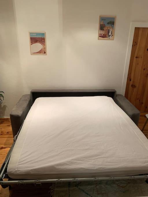 Posteľ alebo postele v izbe v ubytovaní Le petit cocon Nîmois