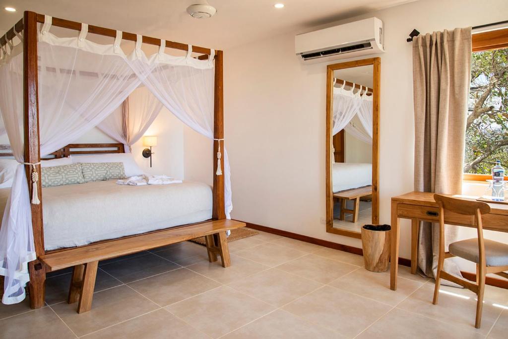 Postel nebo postele na pokoji v ubytování Tierra Magnifica Boutique Hotel
