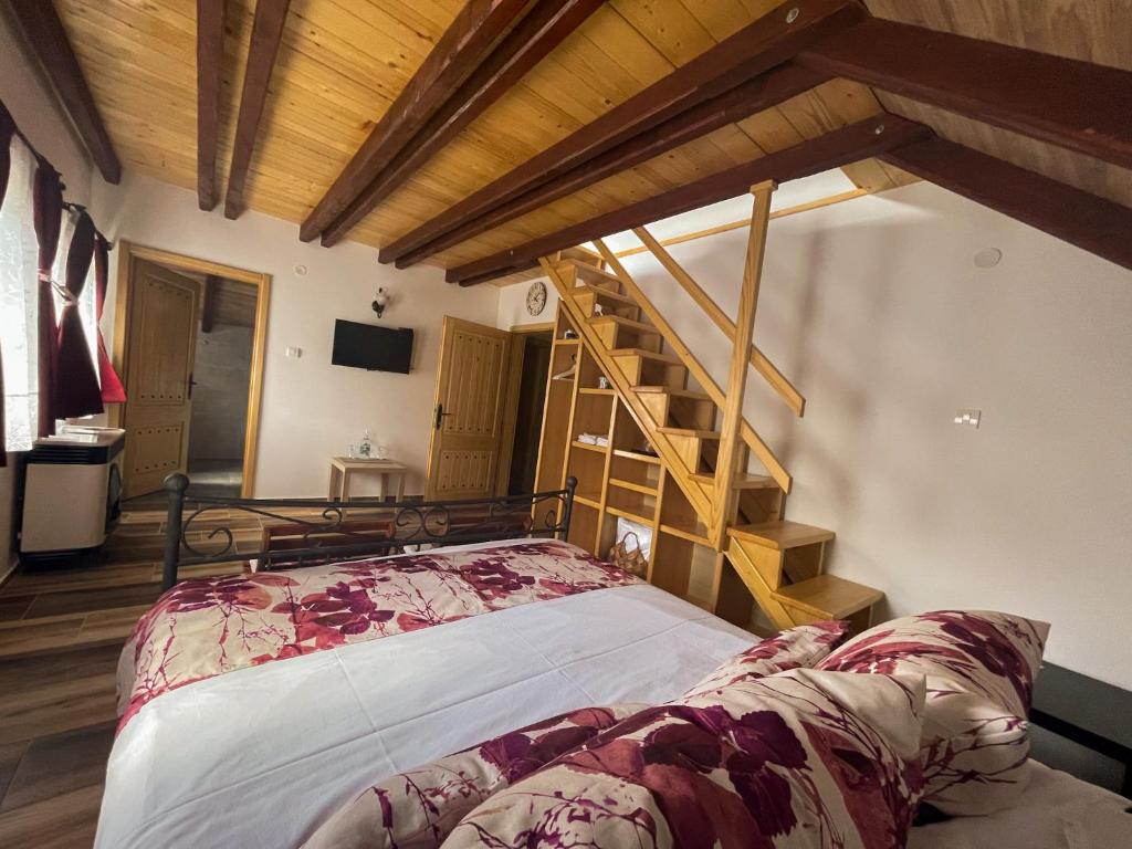 Postel nebo postele na pokoji v ubytování Vila Davidovic-Fruska gora
