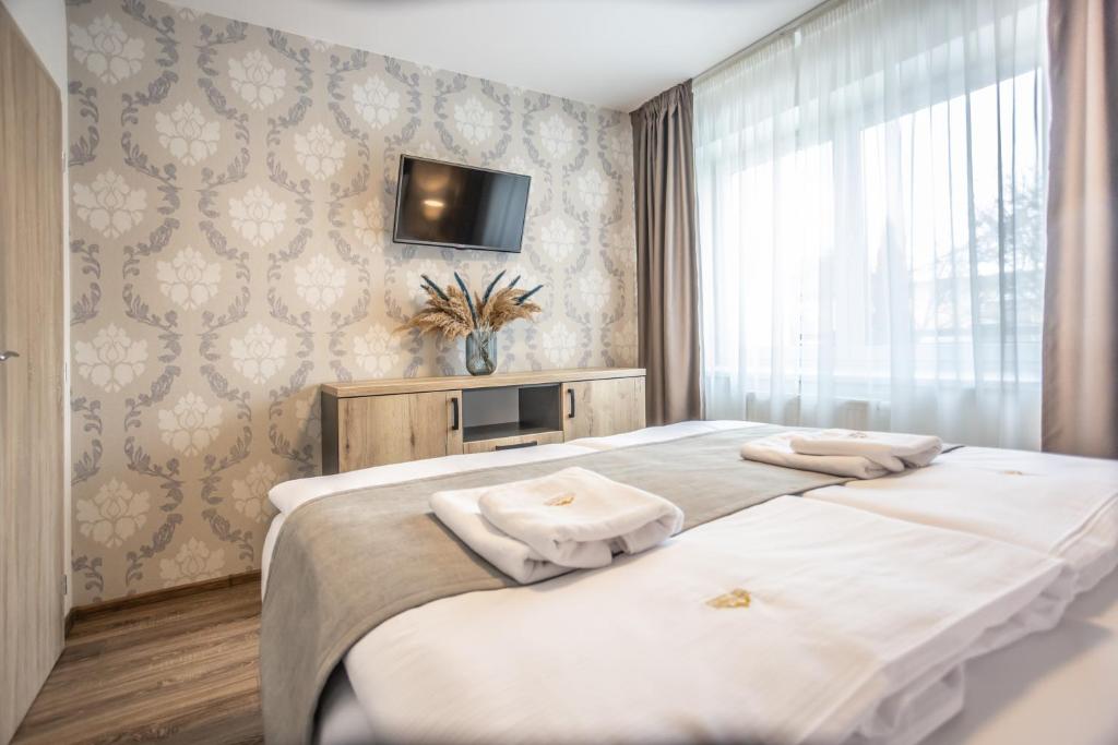 Posteľ alebo postele v izbe v ubytovaní Hotel Demanova Apartments - Dependance