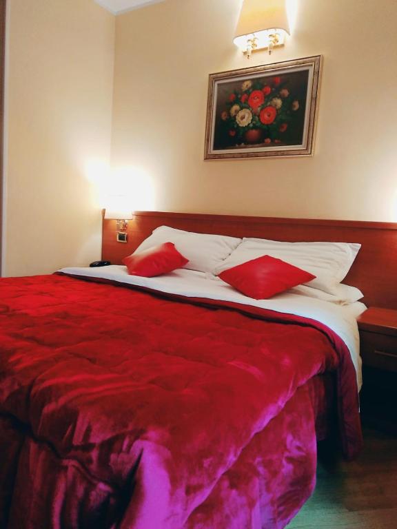 Postel nebo postele na pokoji v ubytování Hotel Fenicia