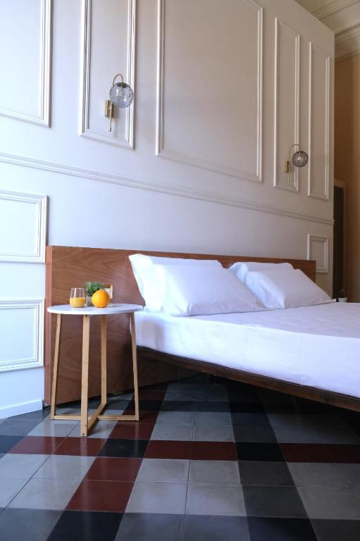 מיטה או מיטות בחדר ב-Toscano Palace Luxury Rooms Catania