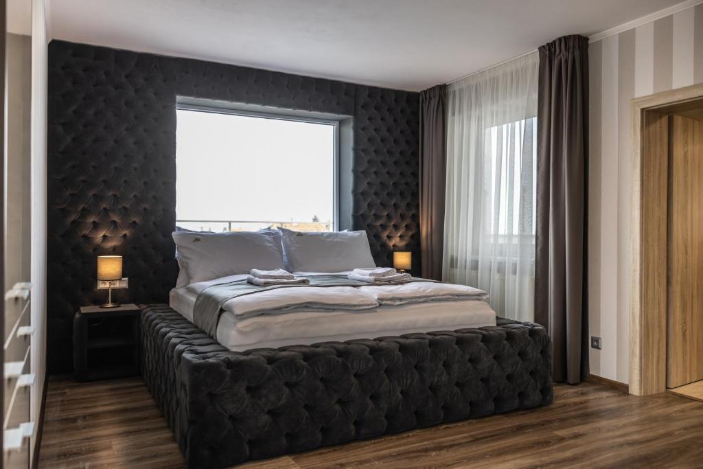 Posteľ alebo postele v izbe v ubytovaní Hotel Demanova Apartments - Dependance
