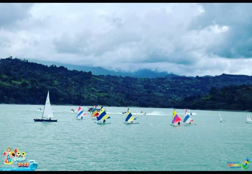 a group of sailboats in a large body of water at Glamping Tiny house 