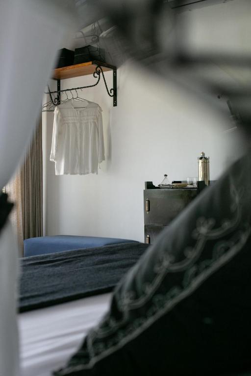 Postel nebo postele na pokoji v ubytování Segredo Uluwatu