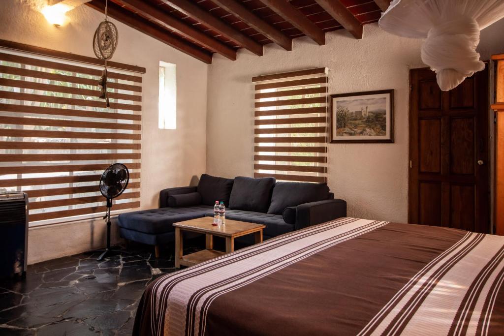 Un ou plusieurs lits dans un hébergement de l'établissement Hotel boutique Teocalli