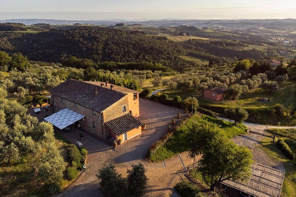 an aerial view of a building with solar panels on it at Villa Sunbathing in Montelupo Fiorentino