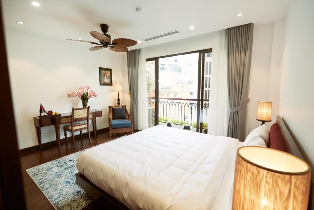 Postel nebo postele na pokoji v ubytování Camellia Residence Hanoi