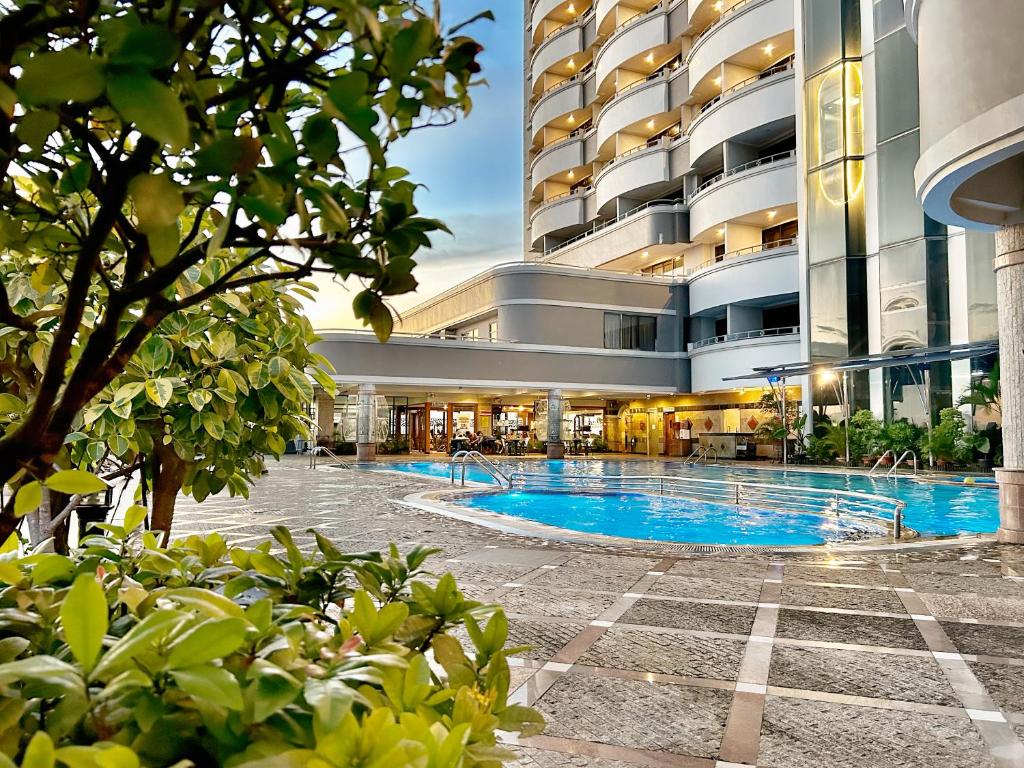 Bazén v ubytování Planet Holiday Hotel & Residence nebo v jeho okolí