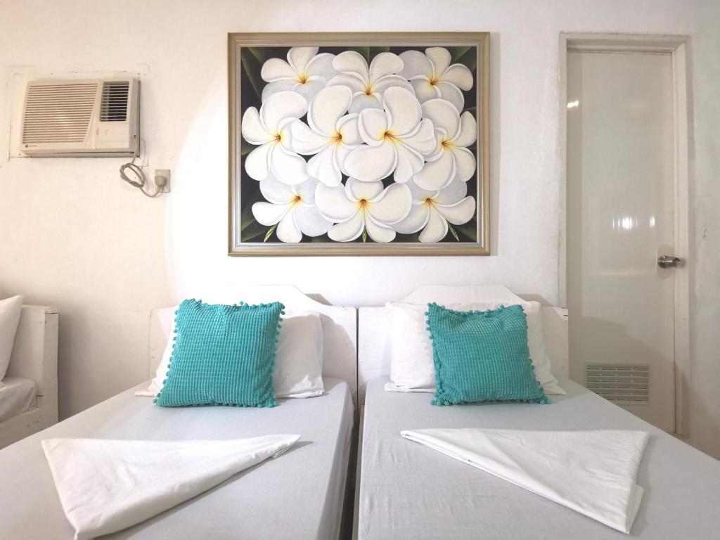 Postel nebo postele na pokoji v ubytování La Vida Hostel Samal Island
