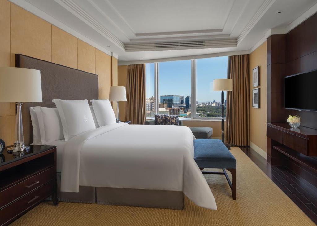 Postel nebo postele na pokoji v ubytování Four Seasons Hotel Beijing