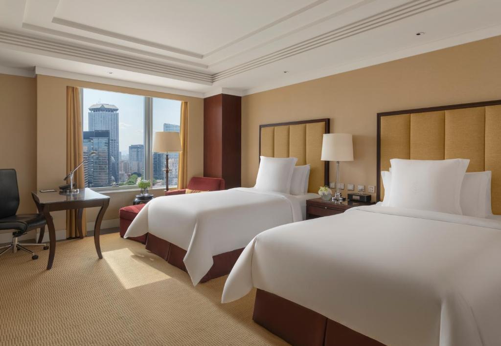Postel nebo postele na pokoji v ubytování Four Seasons Hotel Beijing