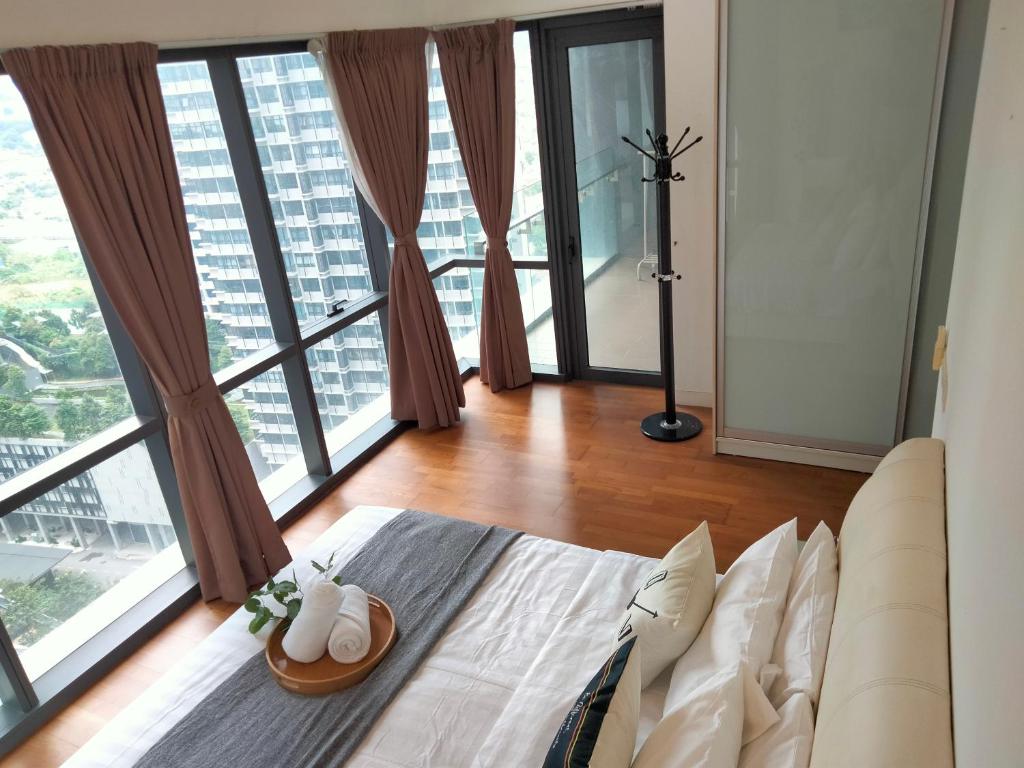a bedroom with a bed and a large window at Element Signature Suites 5pax 3Br Ampang KLCC in Kuala Lumpur