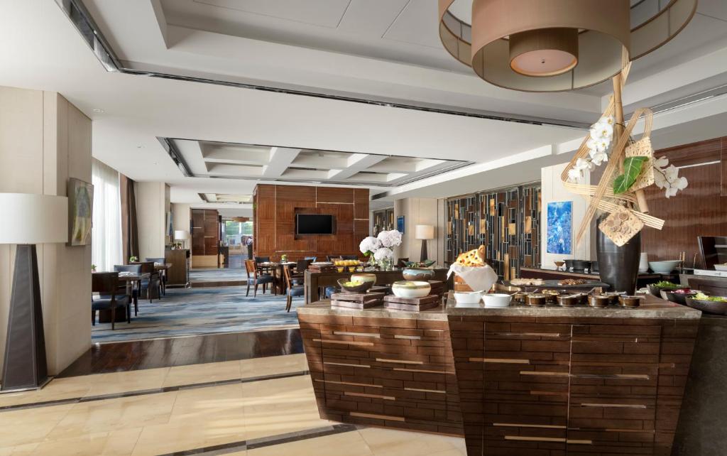 TV a/nebo společenská místnost v ubytování Four Seasons Hotel Beijing