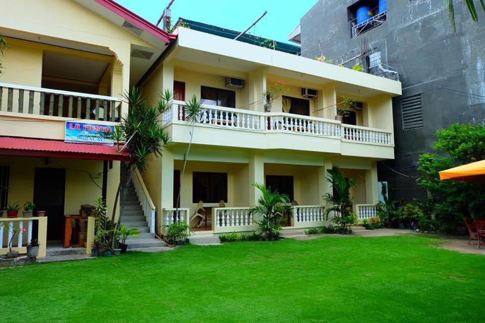 a view of the outside of a building with a yard at LA FIESTA RESORT in Boracay